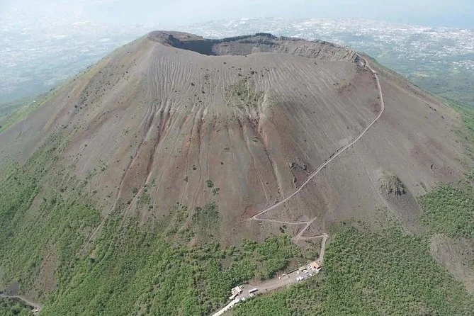 Aerial view of the Vesuvius cone with the path zigzagging up from the car park to the crater